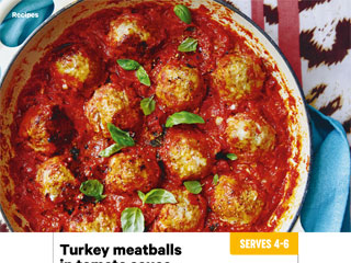 Serve the meatballs with the basil leaves and a grating of pecorino or parmesan.
