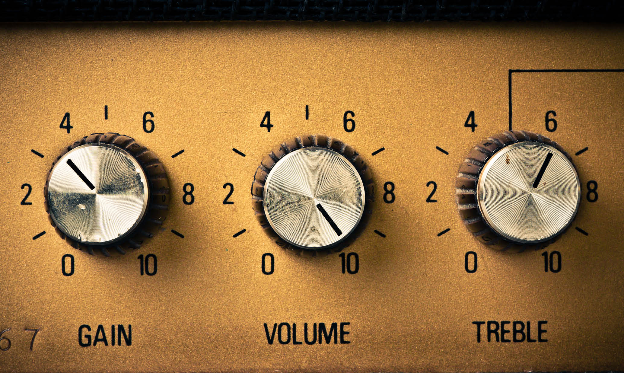 Volume knob to the max on a guitar amplifier. Retro mood.