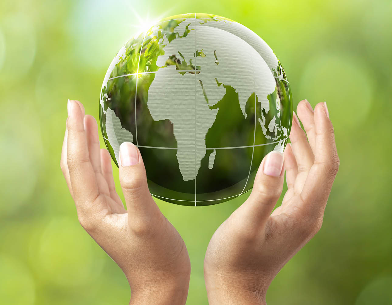 environmental conservation earth concept, woman lifting globe with both hands, earth in woman's hand green bokeh background and white light