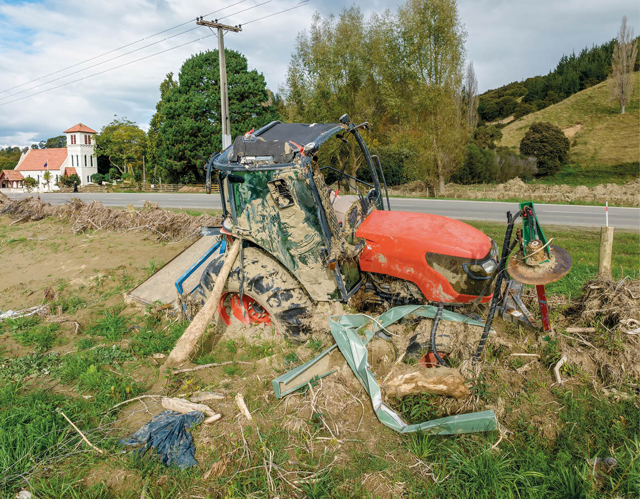 Destryed tractor from the Cyclone Gabrielle natural disaster. Pohokura-Bay View, Napier, Hawke's Bay, New Zealand. February 2023