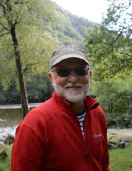 A group of people sitting in chairs in a room Description automatically generated