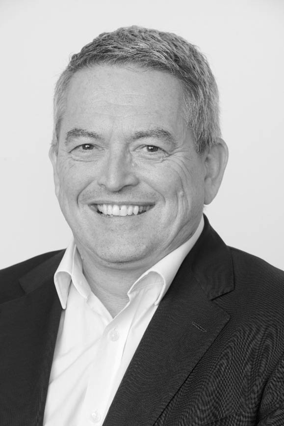 A group of people sitting in chairs in a room Description automatically generated